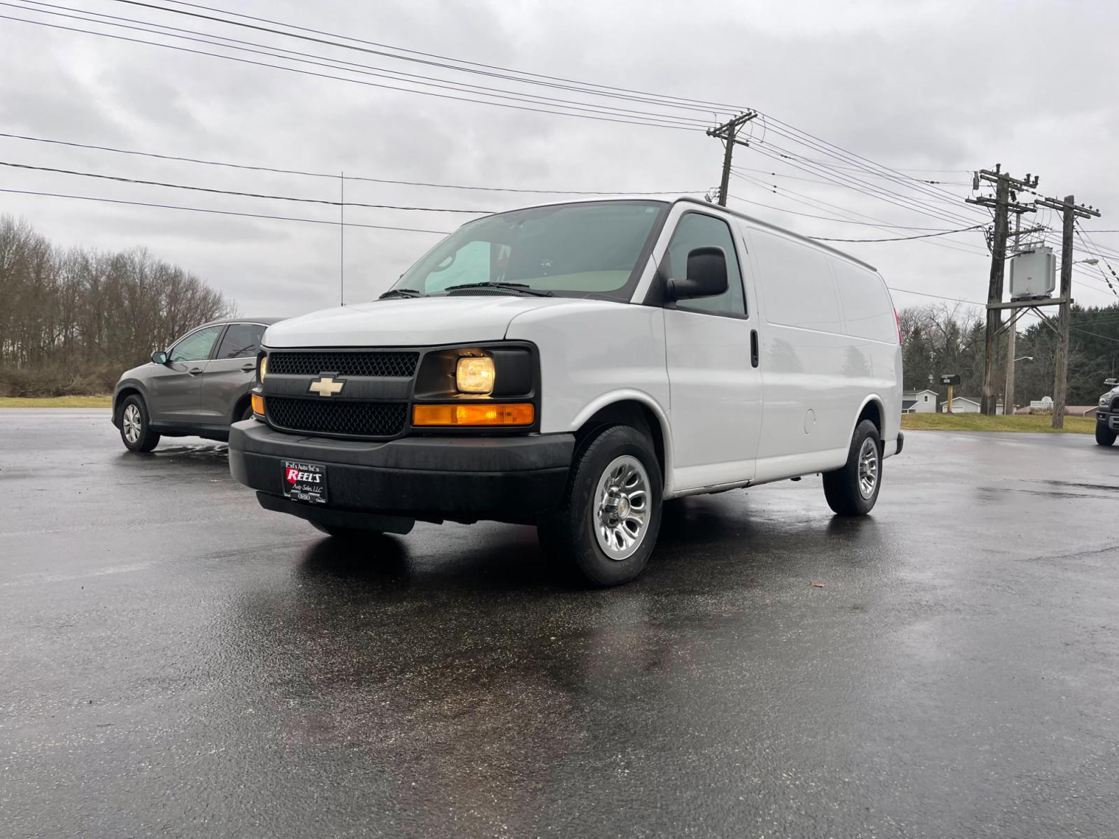 2014 White /Neutral Chevrolet Express 1500 AWD Cargo (1GCSHAF4XE1) with an 5.3L V8 OHV 16V FFV engine, 4-Speed Automatic transmission, located at 547 E. Main St., Orwell, OH, 44076, (440) 437-5893, 41.535435, -80.847855 - This 2014 Chevrolet Express 1500 Cargo Van with a 5.3L Vortec V8 engine and all-wheel drive is a versatile and robust vehicle designed to meet various transportation and towing needs. It comes equipped with convenient features such as power windows, power locks, and a backup camera for safer reversi - Photo #0